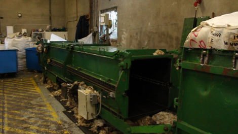 This machine is a wool press, it packs the sorted fleece tightly into bales for storage and transportation.